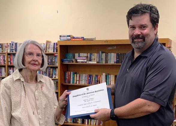 Jackie McNew (left) presented The Snyder News publisher Bill Crist with a certificate of appreciation after he spoke about the First Amendment with members from the Martin Preuitt Jr. chapter of the Daughters of the American Revolution Tuesday.