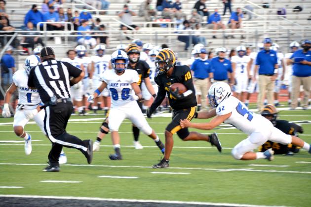 Snyder’s Cameron Smith (10) rushes past Lake View defenders during Friday’s 36-12 victory. This Friday, the Tigers will visit Tuscola to take on the Jim Ned Indians at 7:30 p.m.  