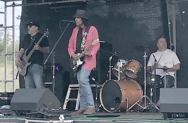 The East 48 Band, consisting of bassist Roel Tello (left), electric guitarist Ruben Tello (center) and drummer Mark Sterlin played at the Diez y Sies de Septiembre celebration.
