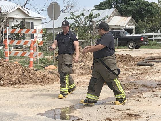Firefighters Ben Atcheson (left) and Freddy Galvan responded to a gas leak Tuesday afternoon near the intersection of 24th Street and Ave. B.