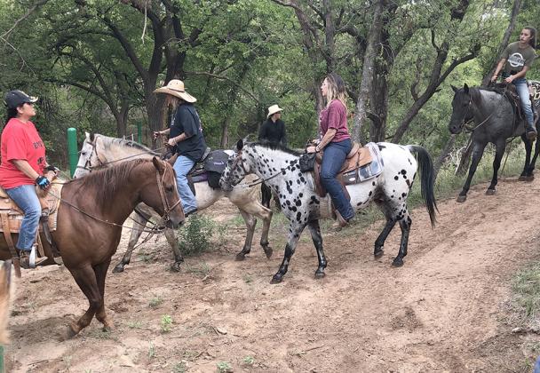 Veterans and volunteers (l-r) Maria Gonzalez, Terri Myrick and Janna Knoll went on a trail ride on the Fuller Family Farms and Ranch.