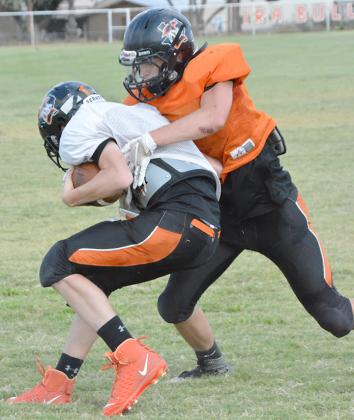 Ira junior Cody McCowen (right) tackled freshman Kaden Foree during practice at Bulldog Stadium Tuesday. Ira will travel to Jayton to face the Eagles at 7:30 p.m. Thursday.