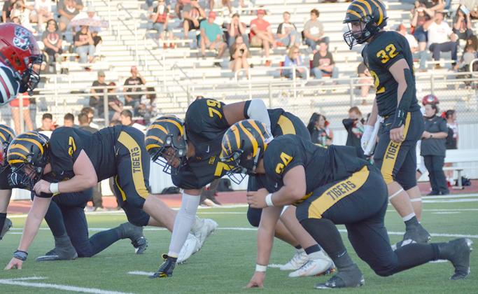 Snyder defenders (l-r) senior Nathan Beaver, junior Xander Richardson, junior Mason Haynes and junior Bryce Ford lined up before a play during the Tigers’ 20-14 loss to Slaton last week. The Tigers will have to stop the run game of the Levelland Lobos on Friday.