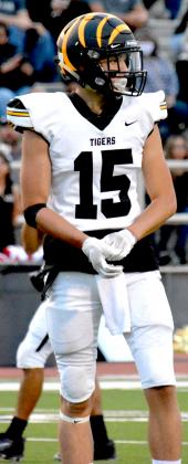 Snyder junior Tim Henderson adjusts his gloves. Henderson recorded an interception for the second week in a row.