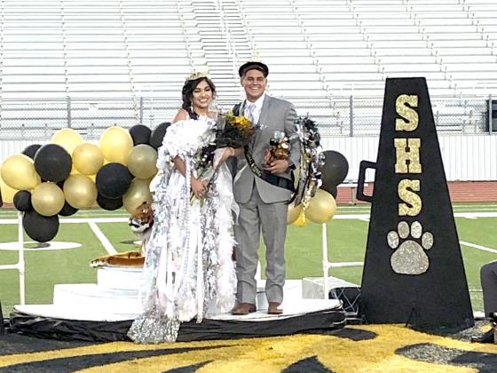 2020 Snyder Homecoming Queen Kimberly Cortes, left, and Homecoming King Jax Collier pose shortly after being crowned Friday evening.