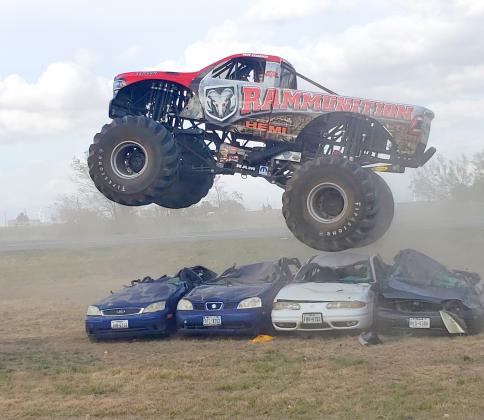 The Rammunition monster truck, driven by Kurt Kraehmer of the Hall Brothers Racing Team of Champaign, Ill., leapt over four cars Saturday during a demonstration at Blake Fulenwider Chrysler Dodge Jeep Ram of Snyder. About 75 people turned out for the event.