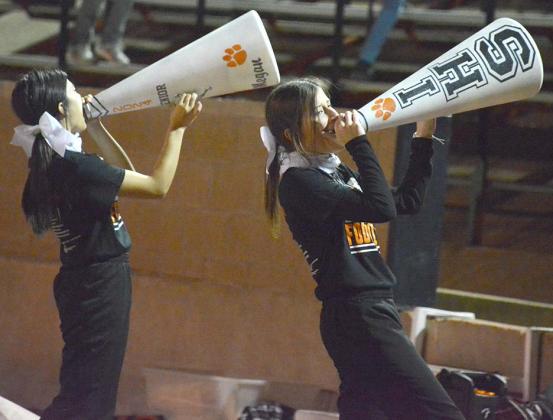 Evelyn Gallegos (left) and Kaci Jo Hafer led the Ira cheerleaders in a cheer