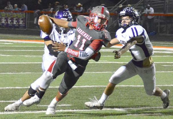 Hermleigh senior Devin Hildebrand ran away from a pair of Sterling City defenders in a 61-12 loss in the bi-district playoffs at Griffith Stadium in Robert Lee Thursday.