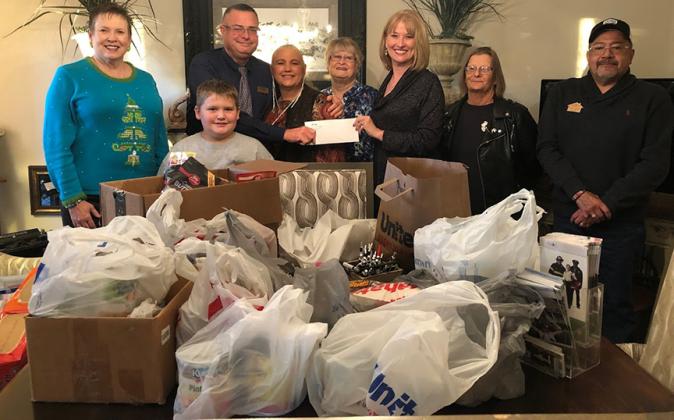 Texas Hometown Real Estate recently presented the WILD Church’s 5n2 Ministry with donated canned food and a $1,200 check. Pictured (l-r) are Deborah Boyd, Treyden Bowlin, Victor Baze, Marti Baze, Jeannie Rice, Melissa Petty, Peggy Womack and George Vasquez.