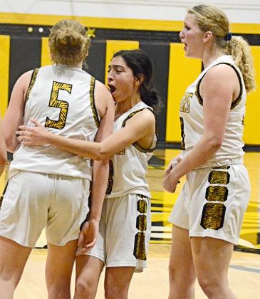 Snyder’s Abby Benitez (center) and Hayley Humphrey (right) cheered for Aaliyah Braziel after she made a layup in the fourth quarter of the Lady Tigers’ 65-57 win over Lubbock Estacado at Tiger Gym on Tuesday. Braziel led all scorers with 23 points.