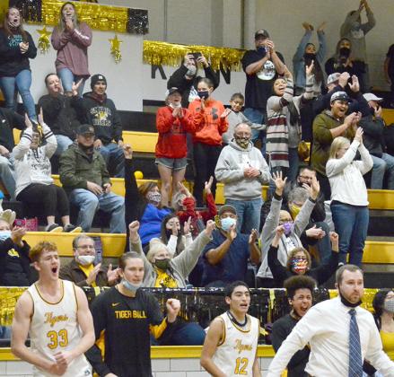 Snyder High School basketball players and fans celebrated during the Tigers’ 46-41 win over the Levelland Lobos at Tiger Gym on Friday