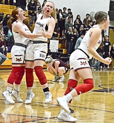 Hermleigh players (l-r) Sarah Murphy, Kaylee Weaver and Becca Kincheloe celebrated as the clock ran out. The Lady Cardinals will return to Wylie High School to face Rankin in the regional semi-finals at 8 p.m. on Monday.