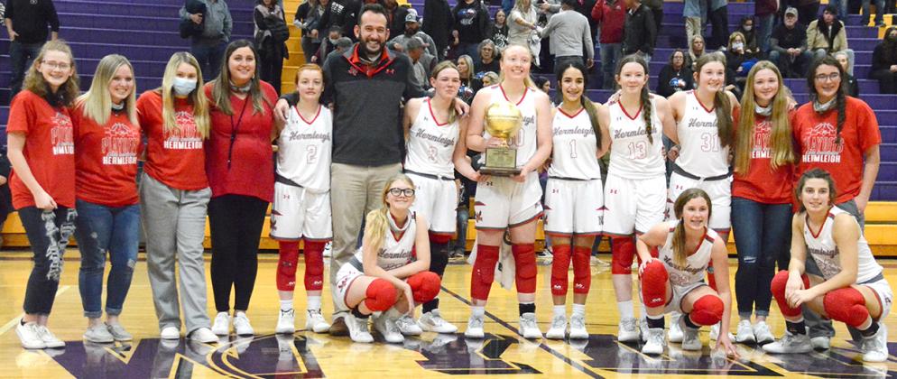 The Hermleigh Lady Cardinals posed with the regional quarterfinals trophy.