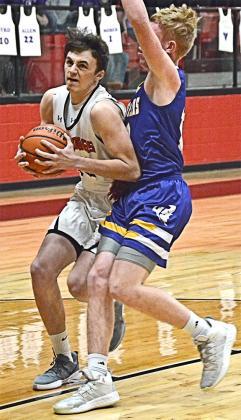 Ira senior Zeke Gallegos worked against a Cross Plains defender for a first quarter score during the Bulldogs’ 38-28 loss. In his final basketball game as a Bulldog, Gallegos led all Ira scorers with nine points.