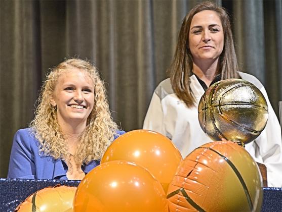 Hayley Humphrey (left) signed a letter of intent to play basketball at Northland College in Ashland, Wis. with Snyder head girl’s basketball coach T’Leah Eicke by her side. Humphrey was a four-year starer for Eicke and the Lady Tiger program.