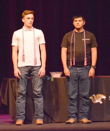 Seniors Bobby Boen (left) and Nathaniel Salinas received cords to signify their decision to go into the military upon graduation.