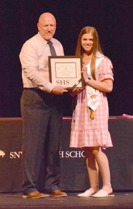 Snyder High School principal Shaye Murphy (left) presented the valedictorian award to senior Eliza Cowley.