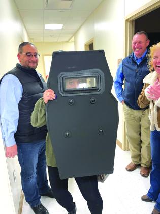 Karri Brunson tested out a police shield at the Snyder Police Department