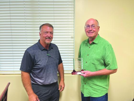 TSN Photos/ Chad Goebel David Cotton (right) was honored for his 42 years of service on the board for First Bank and Trust pictured with Cotton is Shawn Ragland