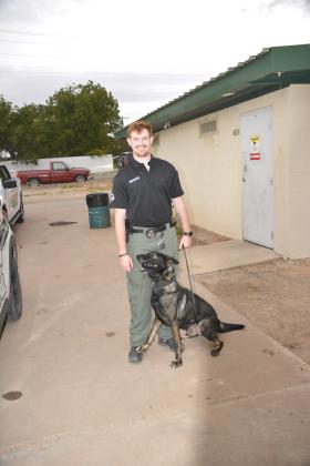 TSN Photo/ Chad Goebel Officer Nick Miller and his K9 Asko posed for a picture at the First Responders National Night Out Tuesday. 