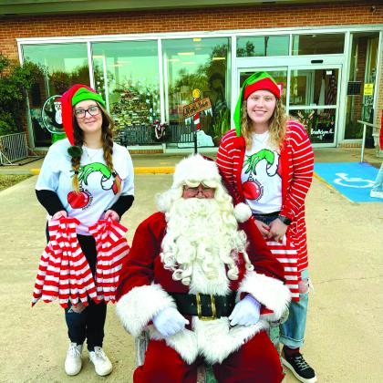 Cloey Waddell and Jessica Carroll posed with Santa