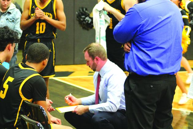 TSN Photo/Lee Scheide Snyder head coach Lee Scott draws up a play during a timeout in the fourth quarter against Big Spring on Tuesday in Big Spring.