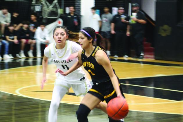 TSN Photo/Lee Scheide Snyder’s Jayci Medrano (2) dribbles the ball up the court as Big Spring’s Emily Carreron (11) pressures on defense during a District 5-4A game on Tuesday in Big Spring