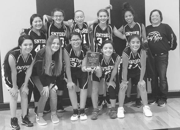The Snyder seventh grade girls’ basketball team won the Snyder Junior High School A Division Tournament title Saturday. Pictured on the front row are (l-r) Lindsey Rios, Tymrie Collier,Jordyn Medrano, Jocelyn Martinez and Ava Aviles. On the back row are Jasmine Hernandez, Peyten Grope, Aaliyah Braziel, Anna Stelluiti, Olivia Green and coach Bianca Gonzalez.