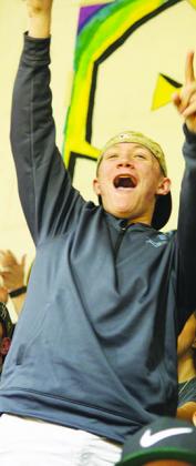 Snyder High School student Matthew Bass cheered for the Tigers during Friday’s District 2-4A basketball opener at Tiger Gym. Snyder will travel to meet Big Spring today.