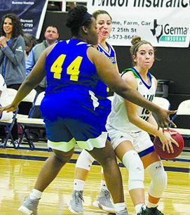 Western Texas College’s Morgan Dial, who scored 22 points, dribbled away from two Frank Phillips College defenders during Thursday’s 79-66 win.