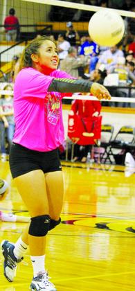 Diamond Escobedo warms up before Tuesday’s volleyball match against Sweetwater. The team wore pink T-shirts in observance of Breast Cancer Awareness Month before the match. Snyder’s Pink Out match will be Oct. 21 against Brownwood.
