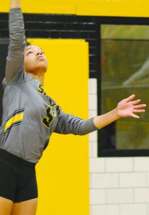 Snyder senior A’Nia Ware served the volleyball during Snyder’s three-set sweep over San Angelo Lake View Tuesday.