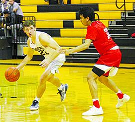 Snyder’s Logan Greene (22) drives against a Denver City player during a game earlier this month. The Tigers were scheduled  to conclude the Sandhills Tournament against host Monahans today.