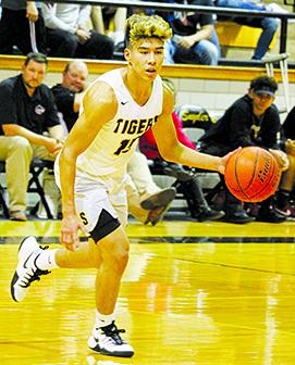 Snyder's Cedrick Quiroz looks for a driving lane during a recent home game. The Tigers will host Stamford in a non-district game Tuesday. The varsity game is scheduled to start at 7:30 p.m.