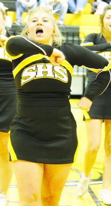 Snyder High School cheerleader Madi Dennis leads the cheers during Tuesday’s basketball game at Tiger Gym. Dennis and the Snyder cheerleaders will join cheerleaders from Hermleigh and around the state to cheer for the Iraan High School football team at Abilene’s Shotwell Stadium during the Class 2A Division II game against Wellington Friday at 7 p.m. 
