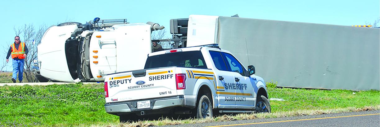 High winds contributed to an 18-wheeler overturning on U.S. Hwy. 84 near Hermleigh Wednesday morning. A sheriff’s deputy said the driver was not injured.