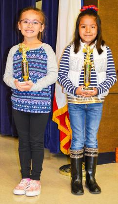 Emily Cortez (right) won the first grade spelling bee at Snyder Primary School on Thursday.  Alba Richards finished second.