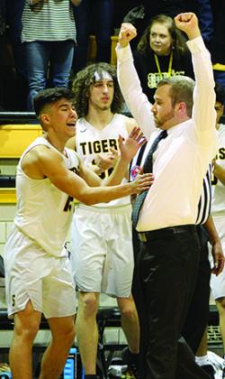 Snyder senior Cedrick Quiroz (left) and head coach Lee Scott celebrate after Friday’s win over Big Spring.