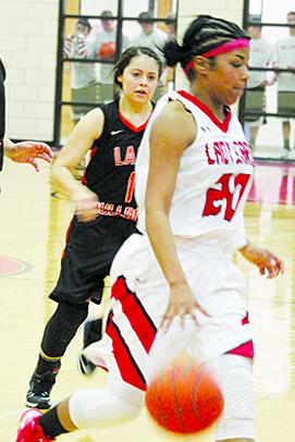 Hermleigh’s Aaliyah Sneed leads a fast-break against Ira during the regular season finale. The Lady Cardinals will play Dawson in a Class 1A bi-district playoff game at 7:30 p.m. today in Post.