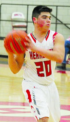 Hermleigh’s Matt Gonzales passes the basketball to a teammate during Tuesday’s game against Loraine. Gonzales scored 11 points in  the 55-34 victory.