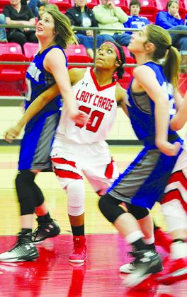 Hermleigh’s Aaliyah Sneed (20) battles for rebound position against two Westbrook players during Tuesday’s 81-44 win.