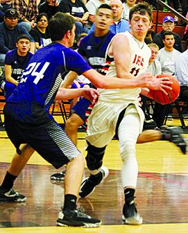 Ira’s Brayden Corley (11) drives against Dawson’s Napper Jackson during Tuesday’s Class 1A bi-district playoff game.