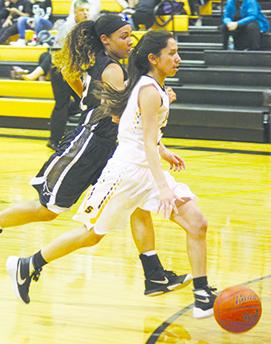 Snyder’s Alyssa Molinar drives to the basket against Big Spring during Friday’s game. The Lady Tigers defeated Big Spring, 50-39.