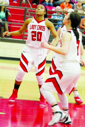 Hermleigh’s Aaliyah Sneed (20) and Kelsey Digby get in position for a rebound during Tuesday’s game.