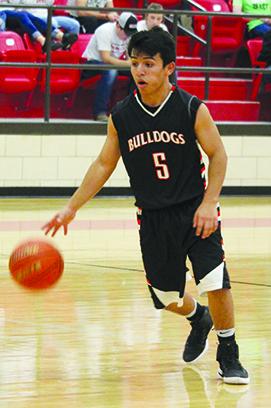 Ira’s Emanual Cabrera drives to the basket during Tuesday’s 53-49 overtime loss at Hermleigh. The Bulldogs will play at Westbrook Friday while Hermleigh will host Highland.