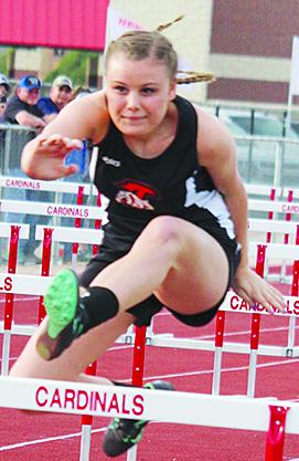 Ira’s Abby Manning cleared a hurdle during the 100-meter hurdles. Manning was fifth. Ira scored 129 points to win the boys’ team championship.