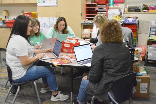 Snyder ISD teachers (l-r) Erica Leija, Carolyn Torres, Stephanie Herrera, Megan Greene and Laura McGinnis worked on preparing material for students at the Snyder Primary School Wednesday. Snyder ISD announced the closure of the school district until April 3 Wednesday.