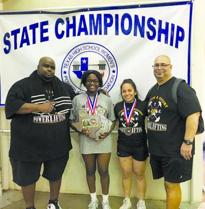 Kerrington Biggers (second from left) and Cheyenne Avila (second from right) won their weight class during Saturday’s Texas High School Women’s Powerlifting Association state meet in Waco. Also pictured are head coach Tremaine Johnson (left) and assistant coach Armando Martinez.