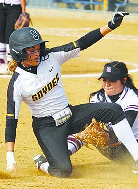 SDN Photo/Larry McCarty Snyder’s Natalee James slides into third base during a recent home game. The Lady Tigers will host Wylie in a District 5-4A game at 5 p.m. Tuesday.