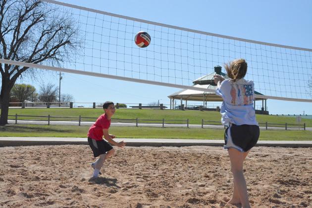 Max Mendoza (left) faced off against his sister, Chloe Mendoza in a game of volleyball in Towle Park Tuesday.